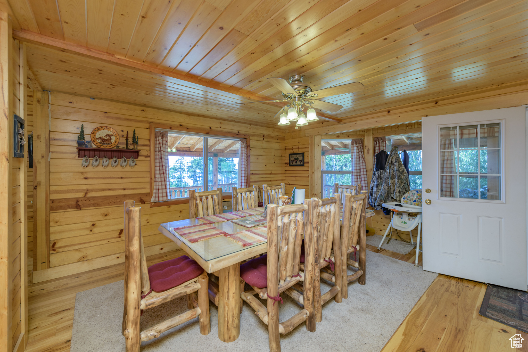 Dining area featuring wooden ceiling, ceiling fan, and light wood-type flooring