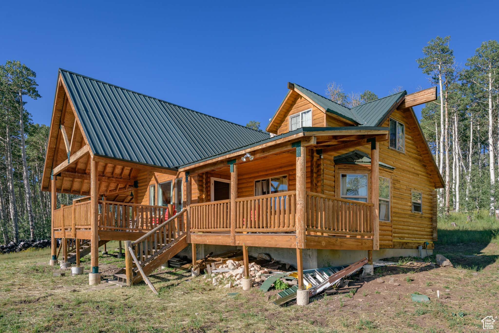 Rear view of house with covered porch