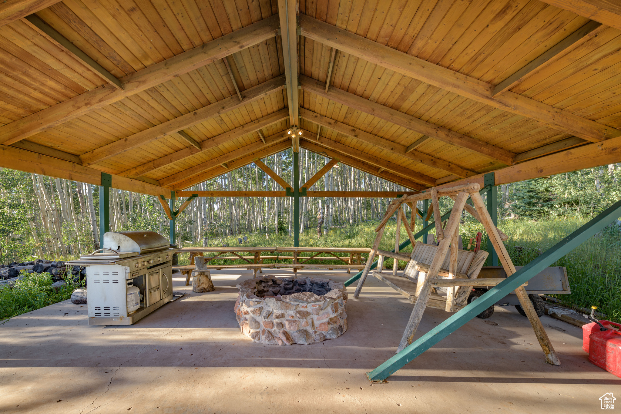 View of terrace featuring an outdoor fire pit and a gazebo