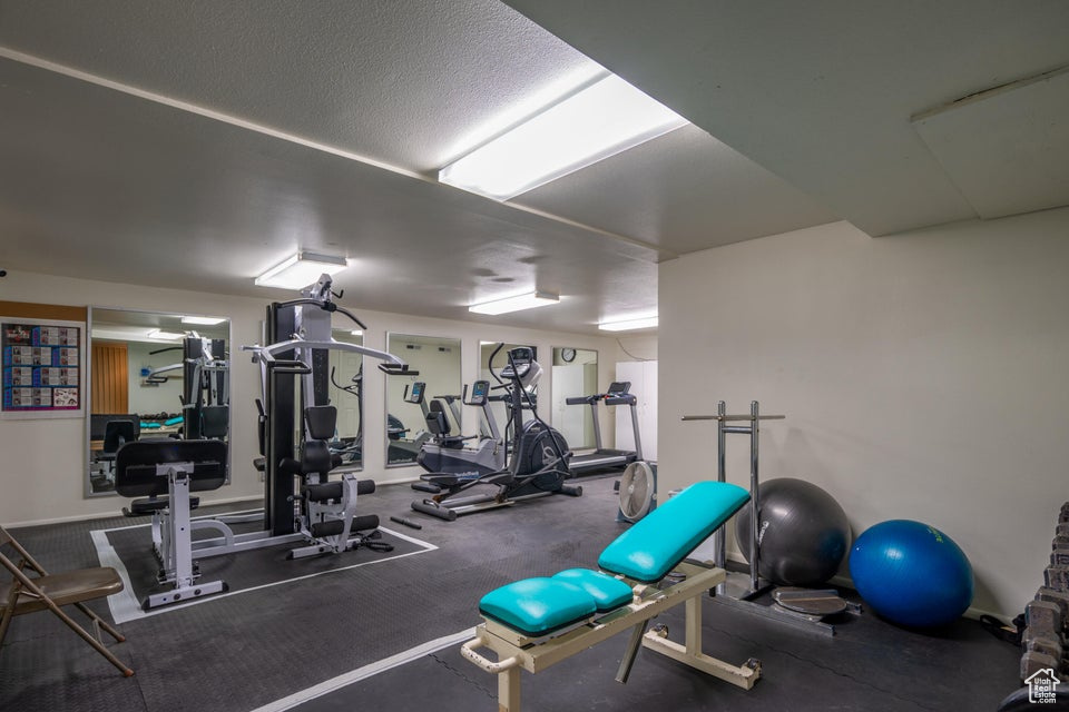 Exercise room featuring a textured ceiling