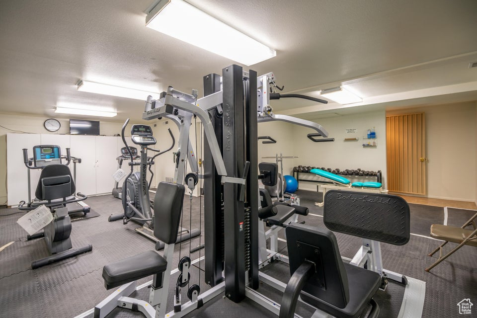 Workout area with a textured ceiling