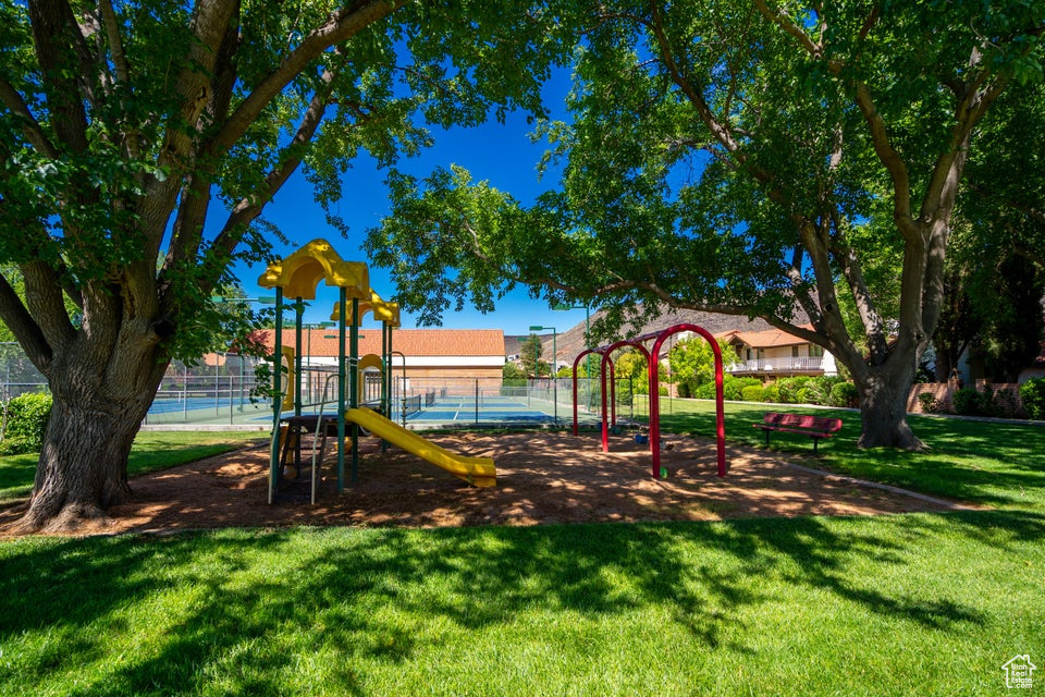 Exterior space featuring a playground and a yard