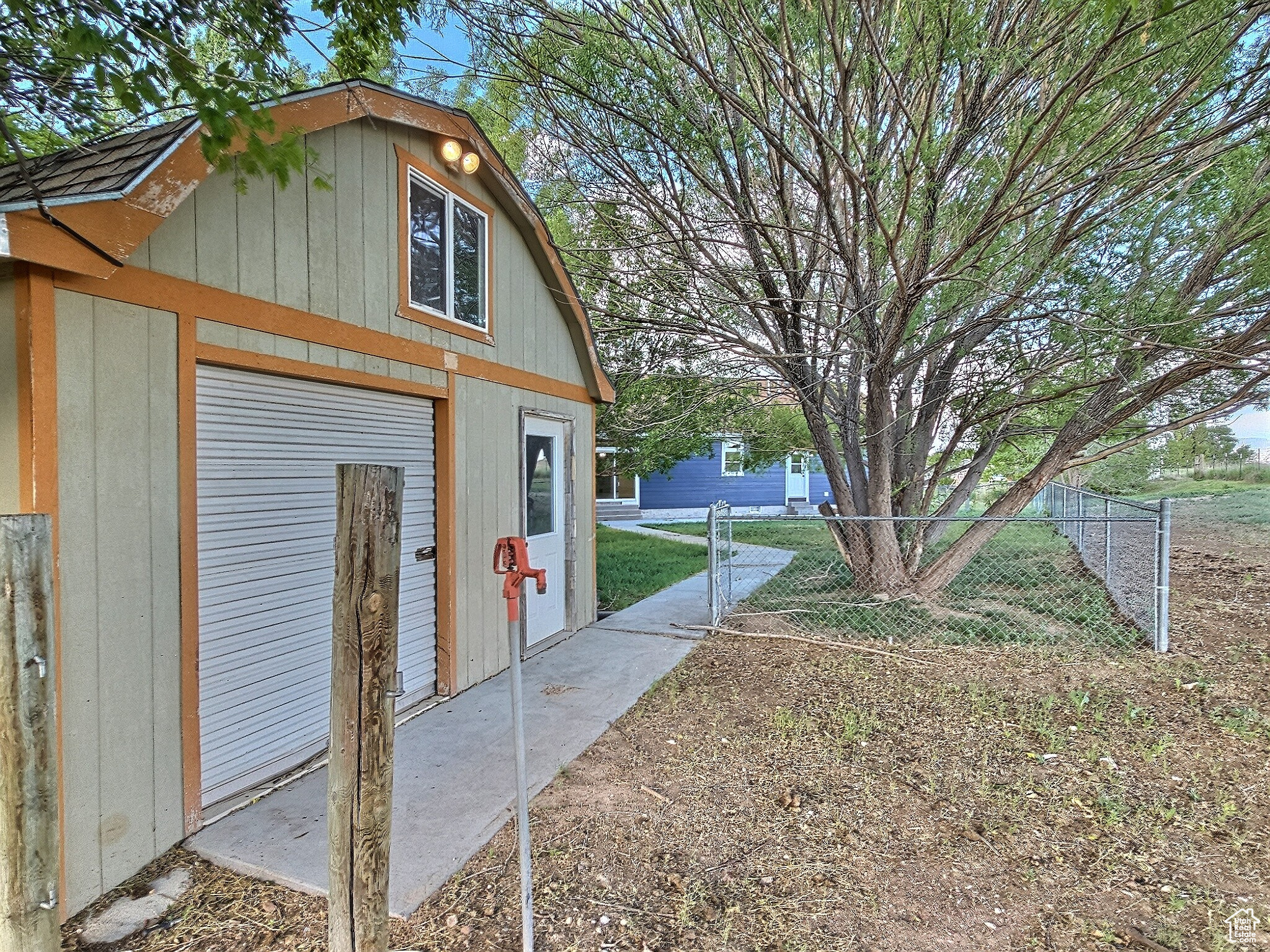 View of property exterior featuring an outdoor structure