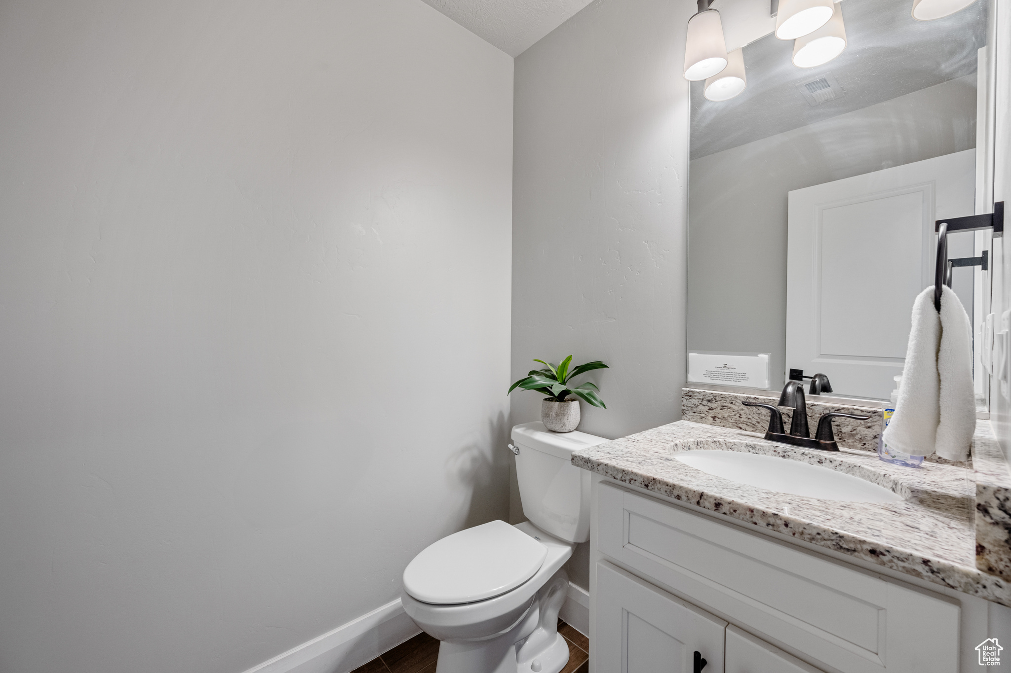 Bathroom with oversized vanity and toilet