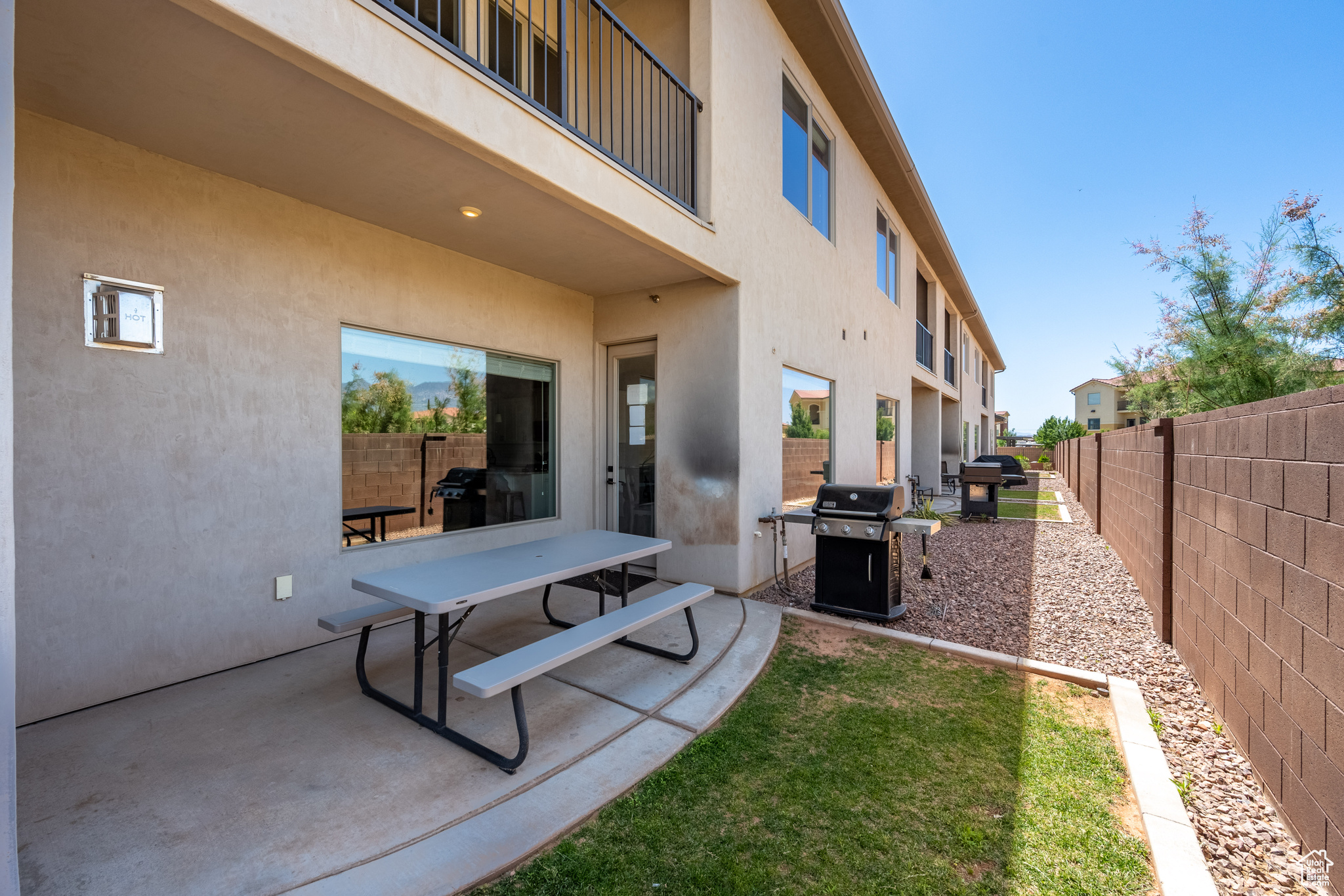 View of yard with a patio area and a balcony