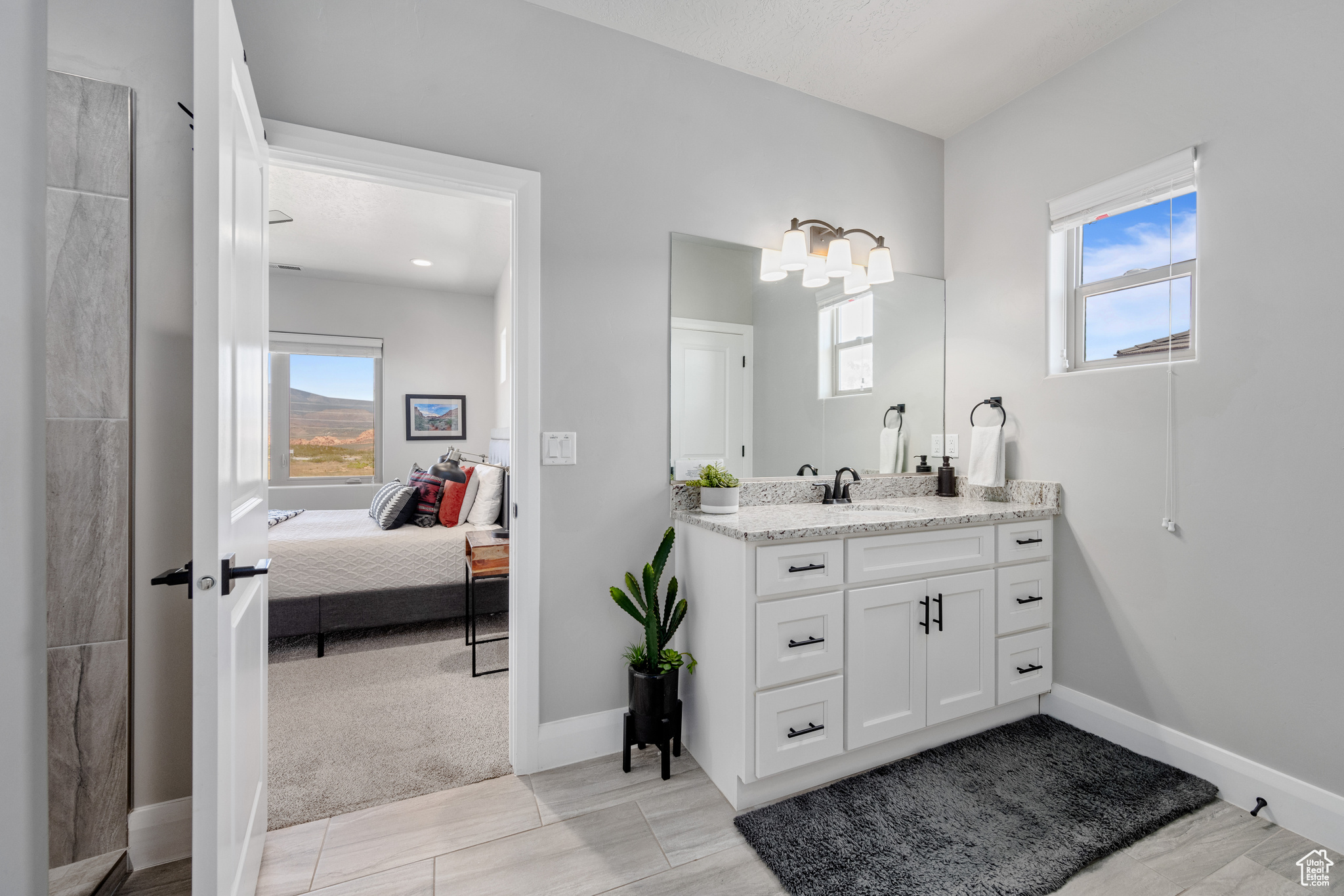 Bathroom featuring oversized vanity and tile floors