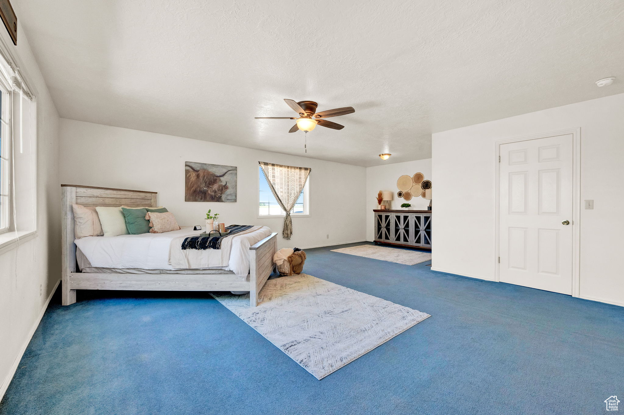 Bedroom with carpet flooring and ceiling fan