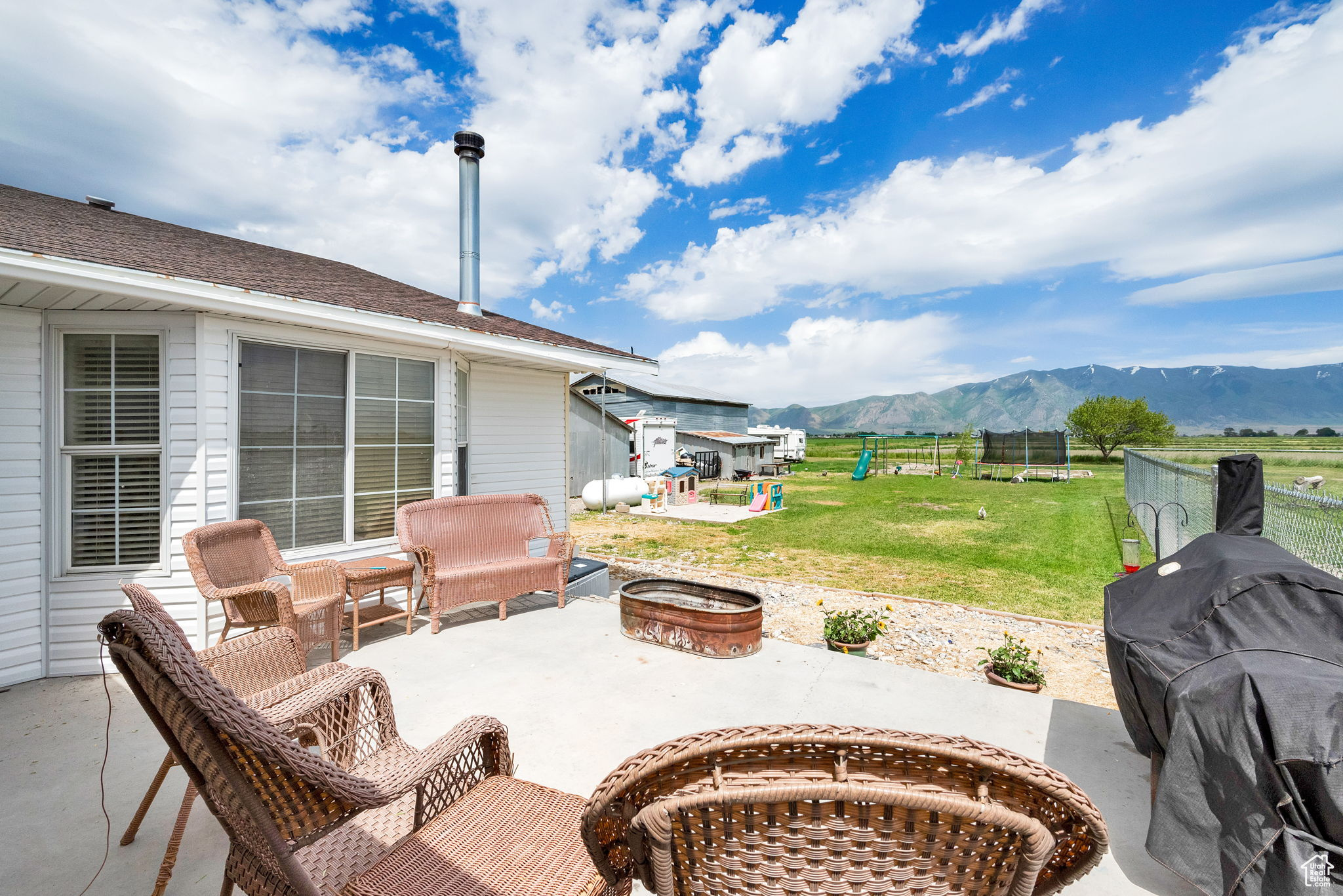 View of patio / terrace featuring a mountain view, area for grilling, and an outdoor fire pit