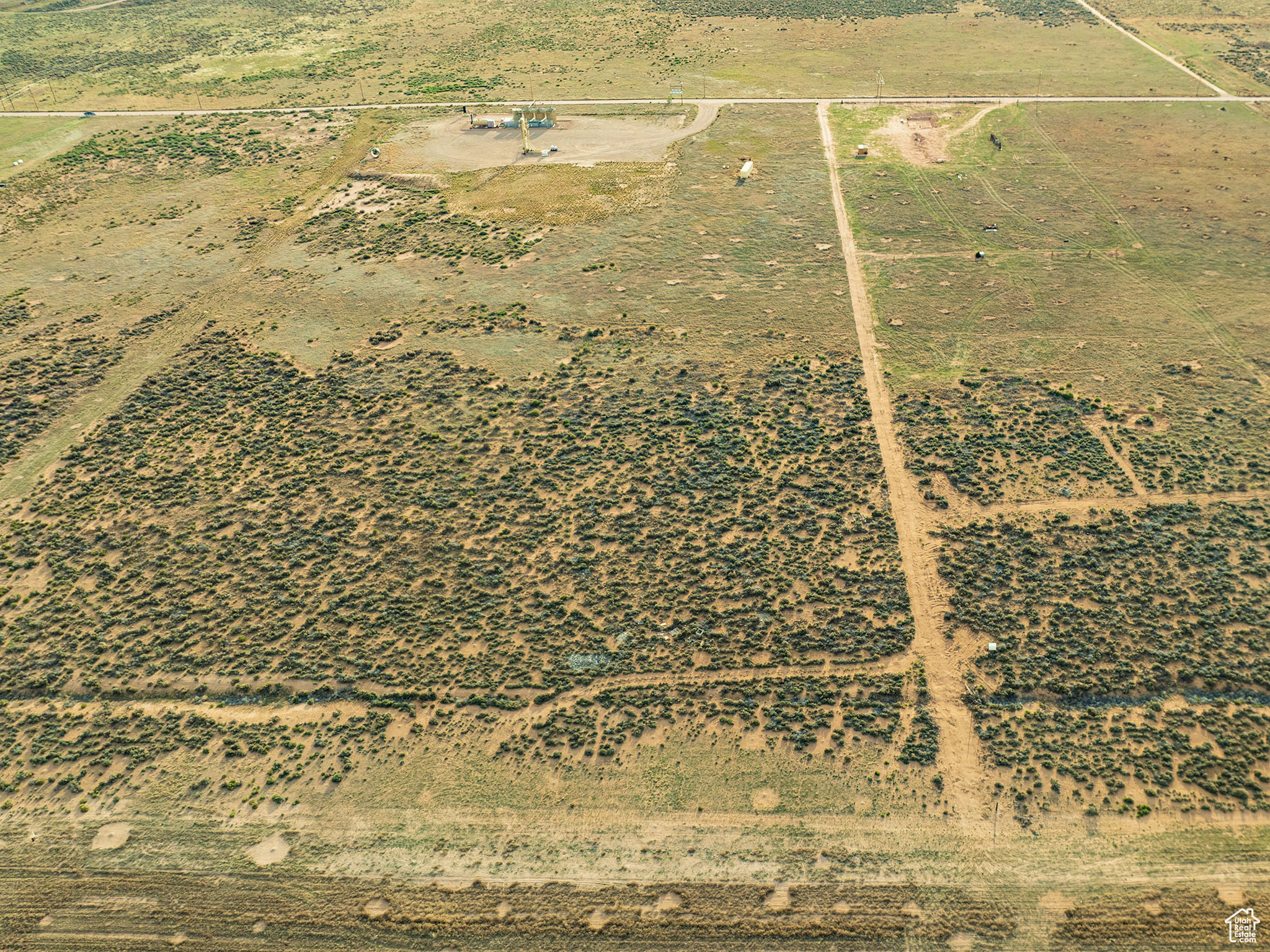 Birds eye view of property featuring a rural view