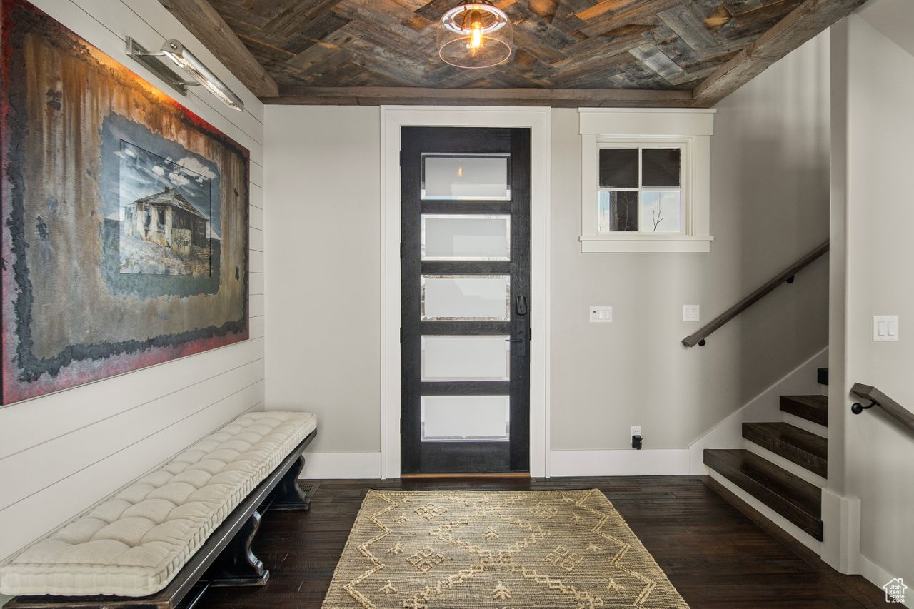 Foyer entrance featuring wooden ceiling and dark hardwood / wood-style floors