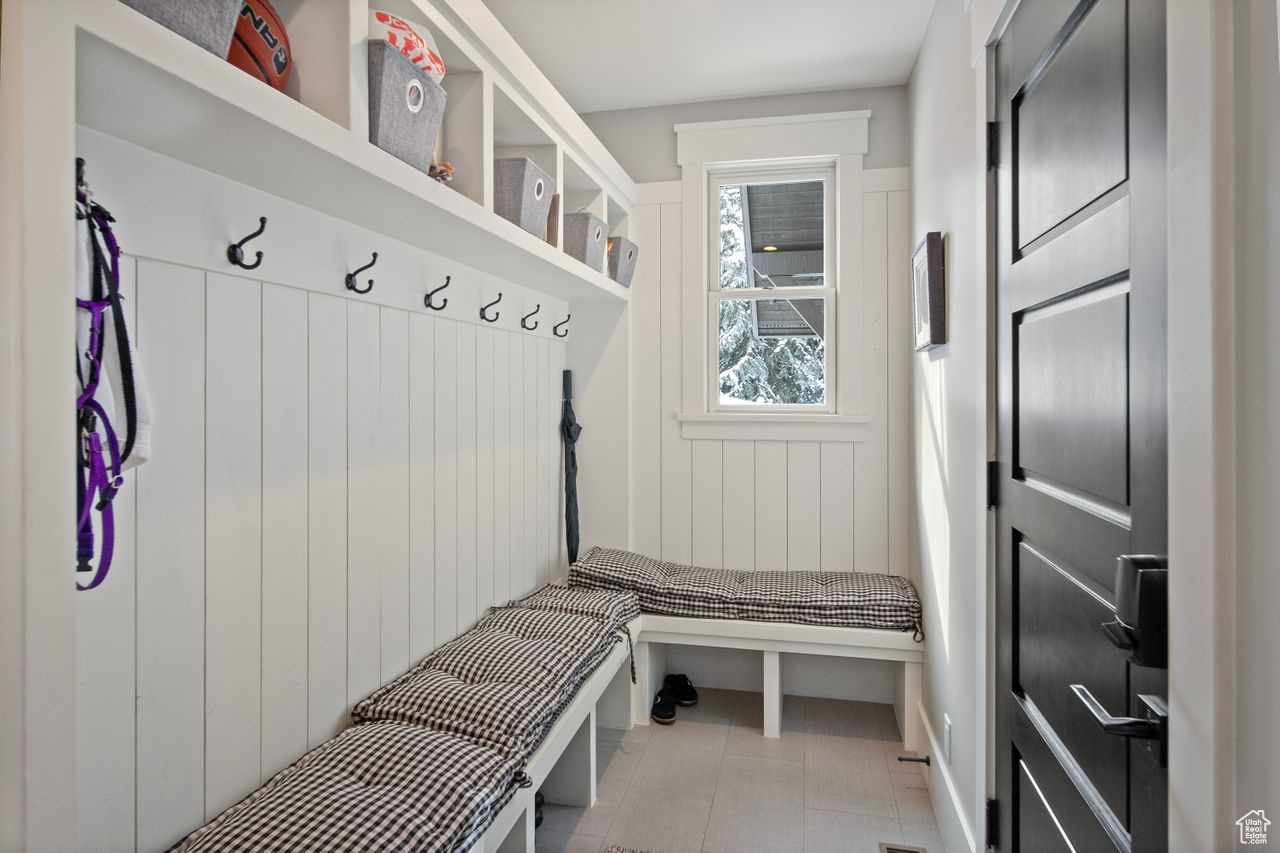 Mudroom with tile floors