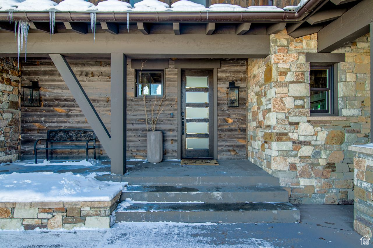 View of snow covered property entrance