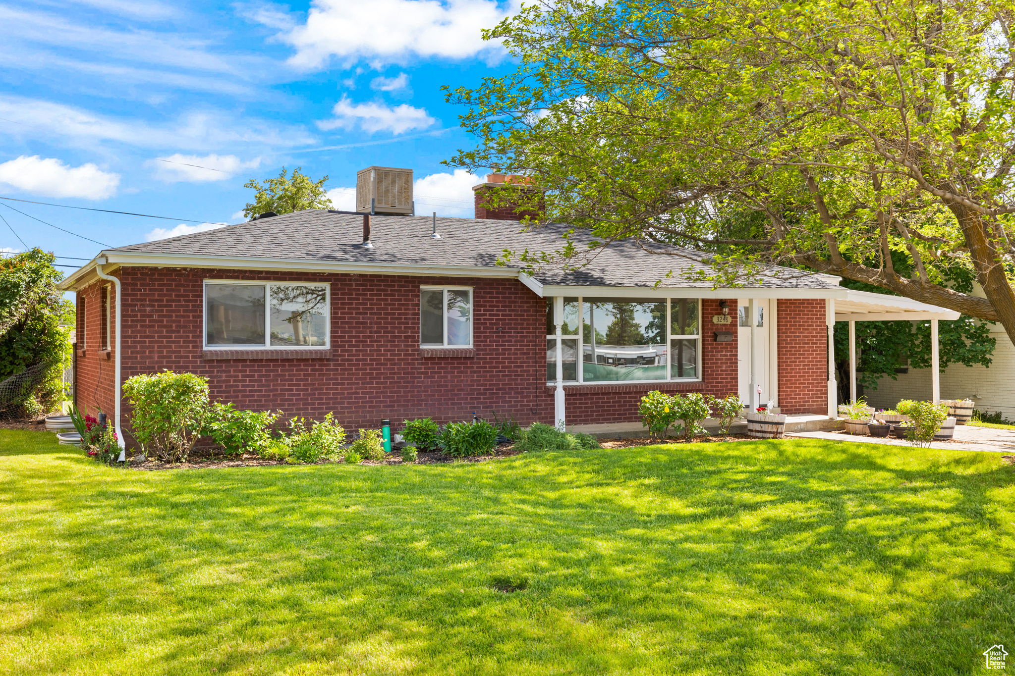 Single story home featuring a front yard