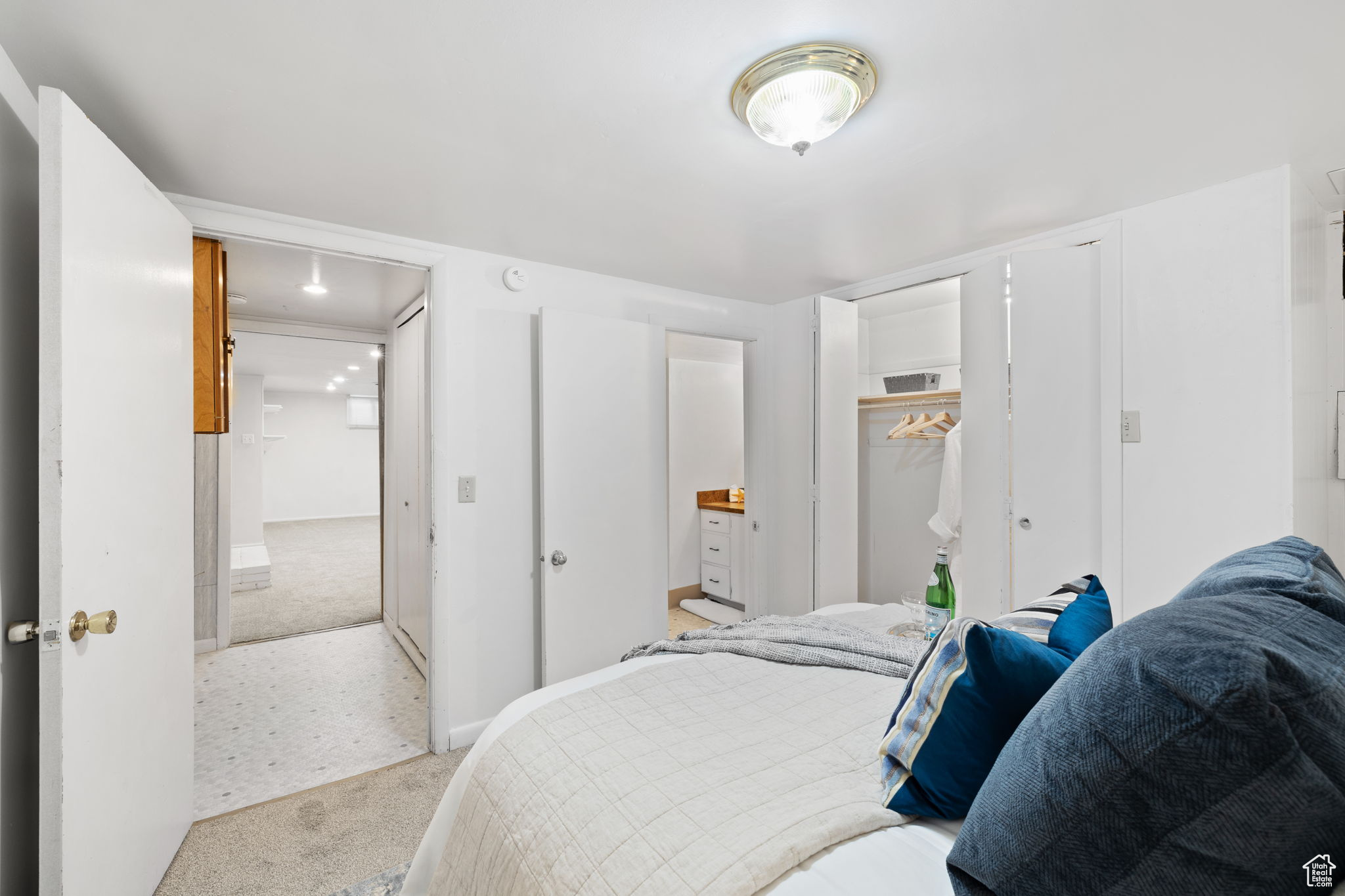 Carpeted bedroom featuring a closet