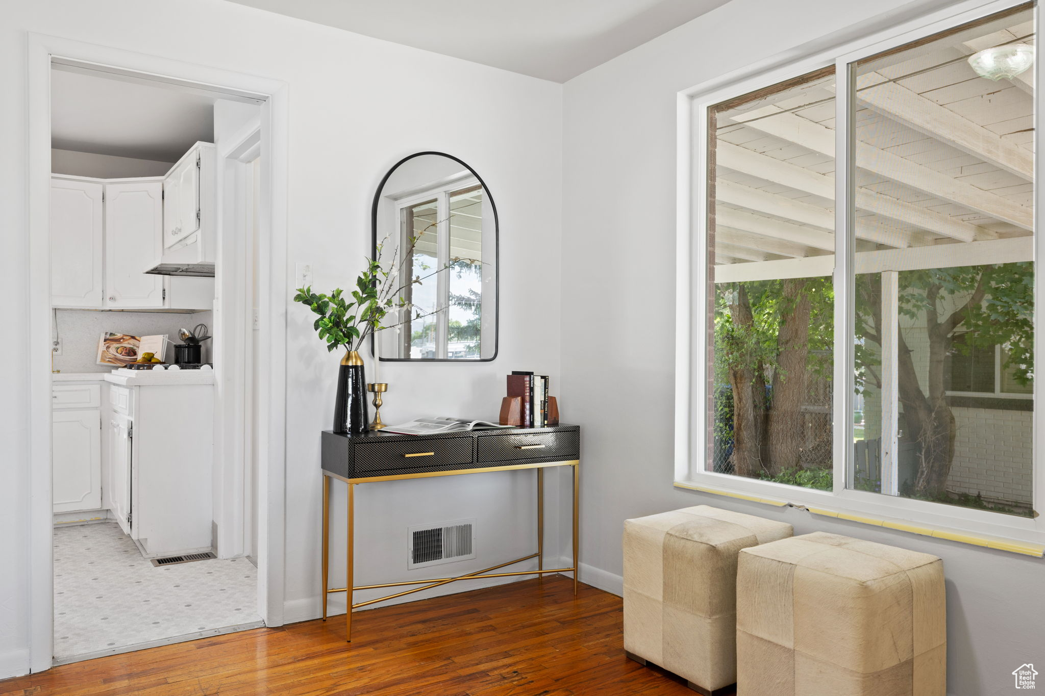 Sitting room with a healthy amount of sunlight and tile flooring