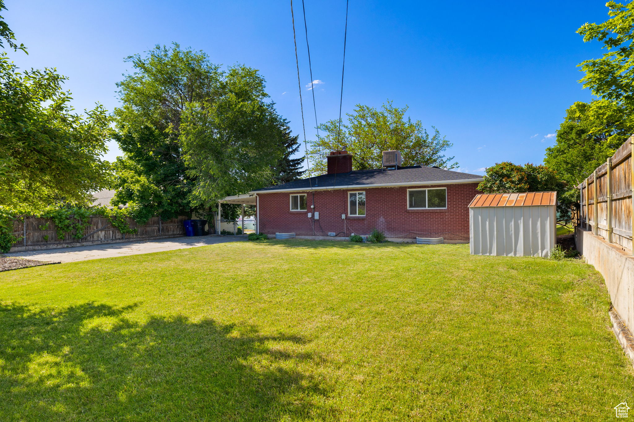 View of yard with a storage unit