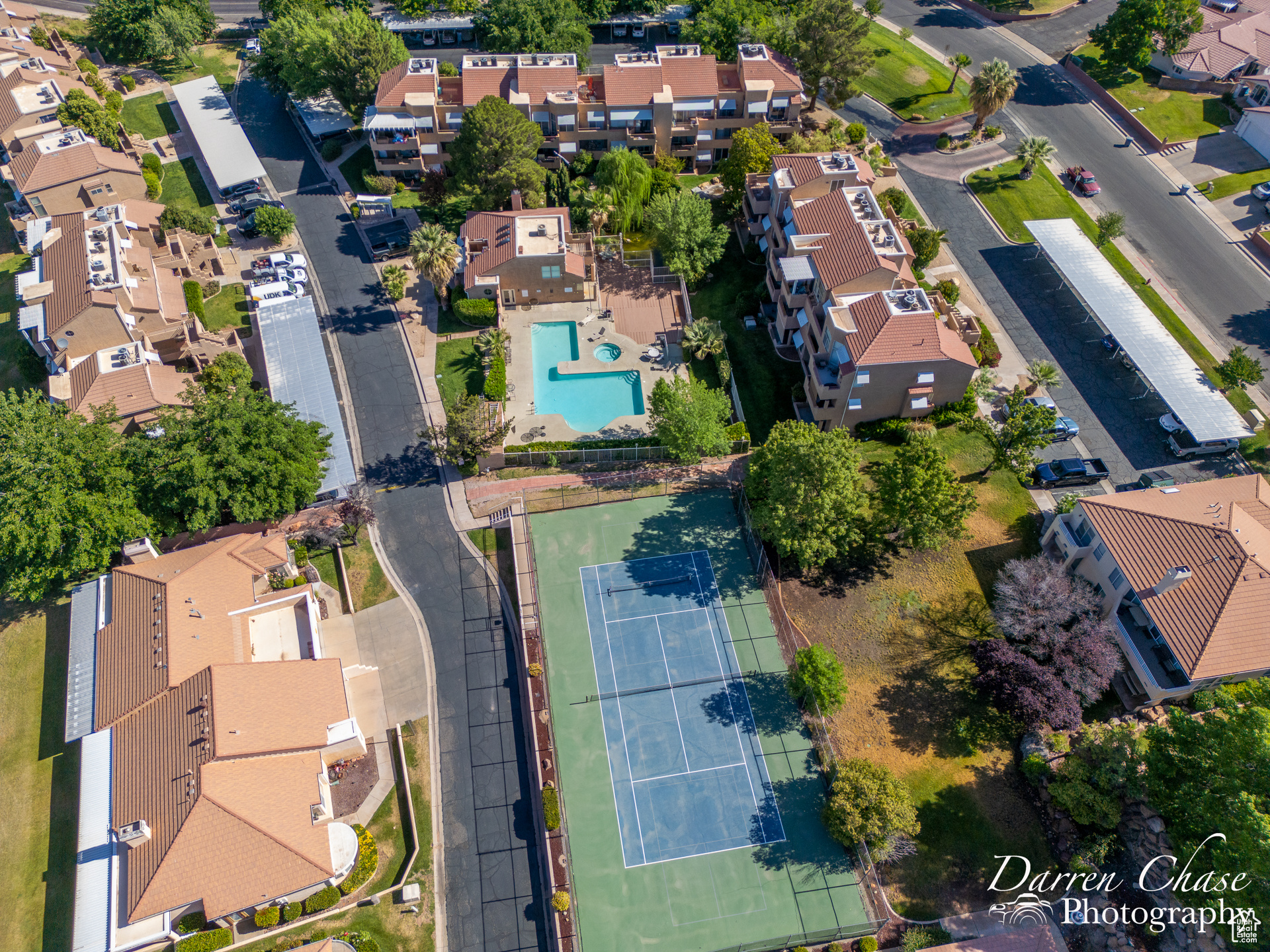 Drone view of pickleball/tennis courts and pool