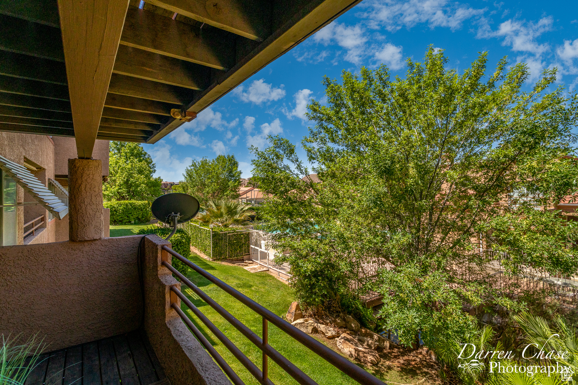 View from back patio to pool and water feature