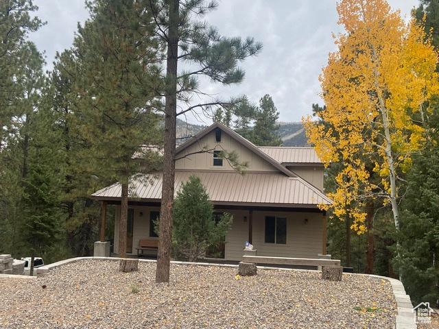 View of front of house featuring a porch / PARKING PAD IN FRONT