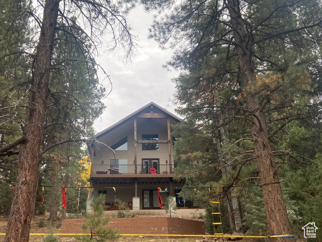 Rear view of property with a balcony