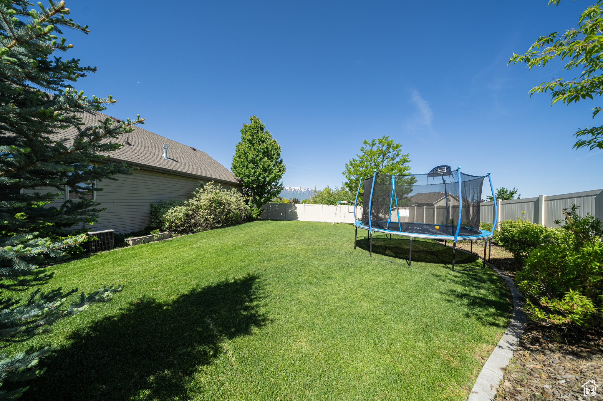 View of yard featuring a trampoline