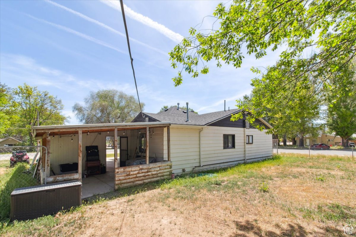 Back of property featuring a patio area