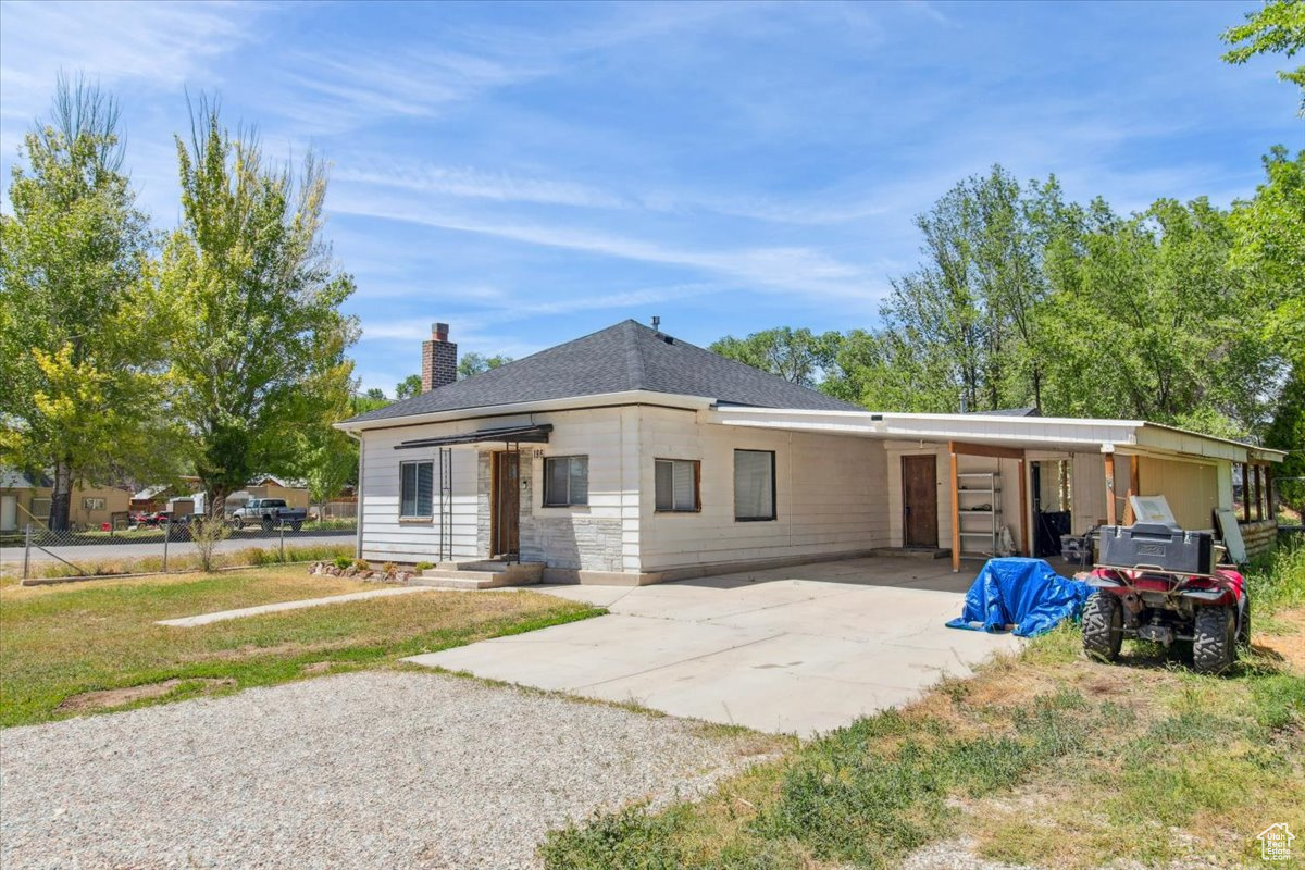 View of front of property featuring a carport