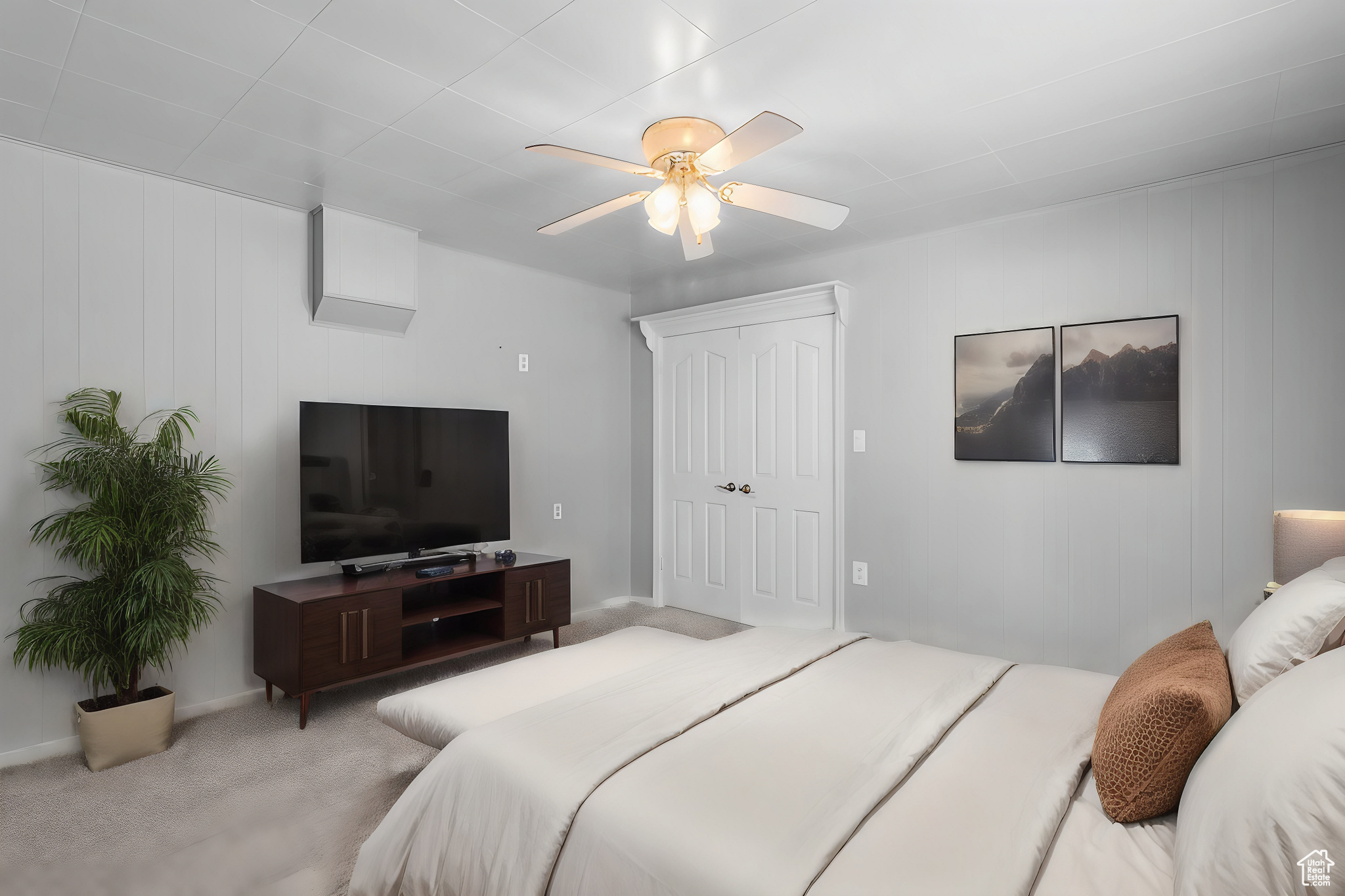 Bedroom with a closet and ceiling fan