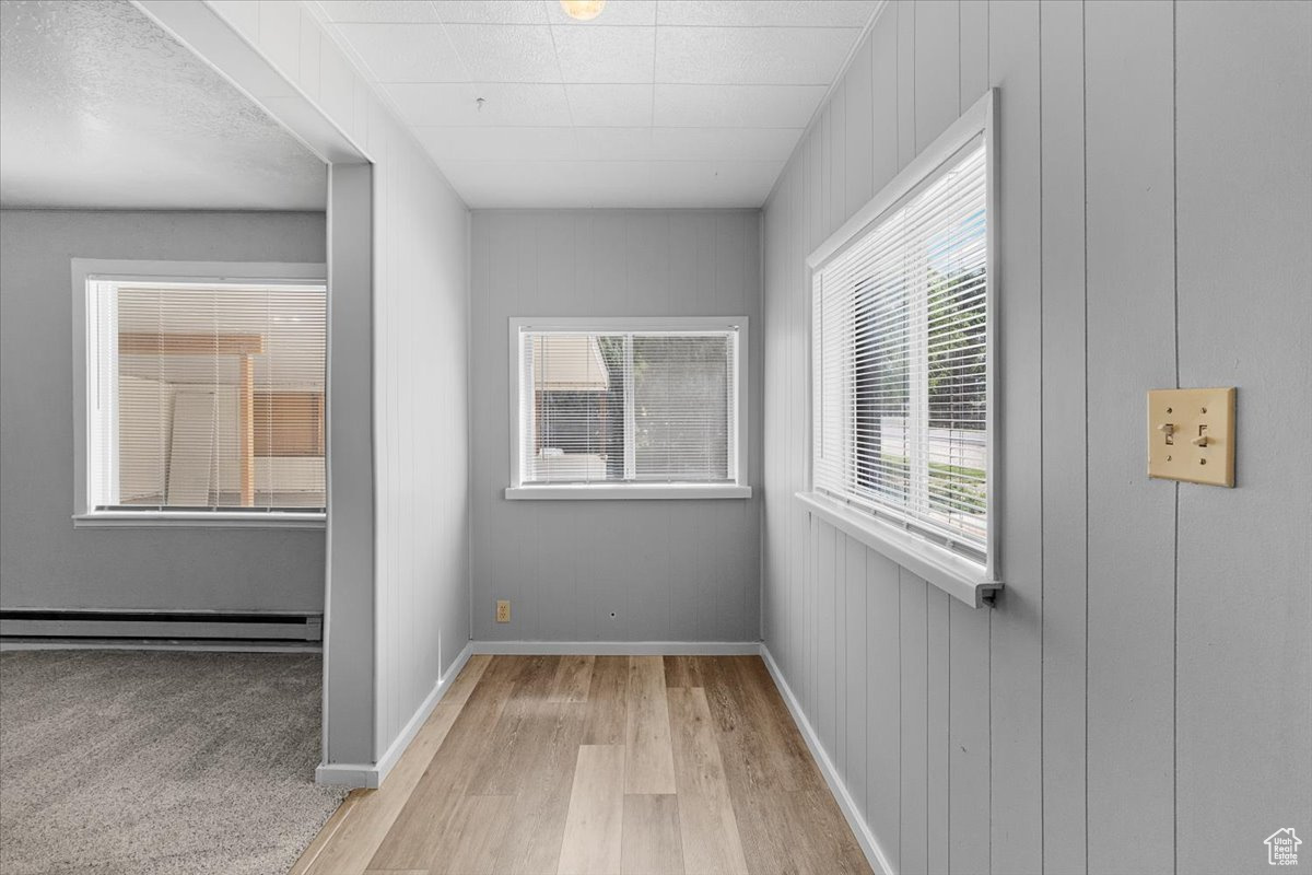 Interior space featuring light hardwood / wood-style flooring and baseboard heating