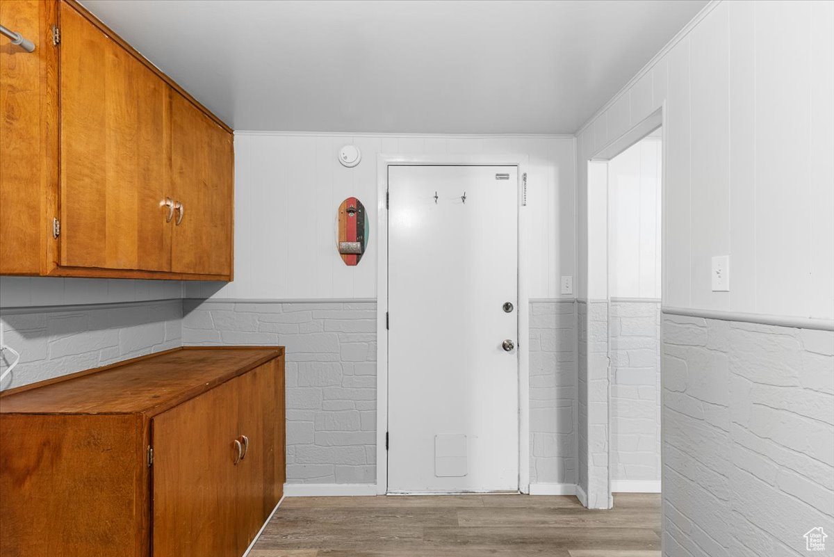 Hallway with light wood-type flooring