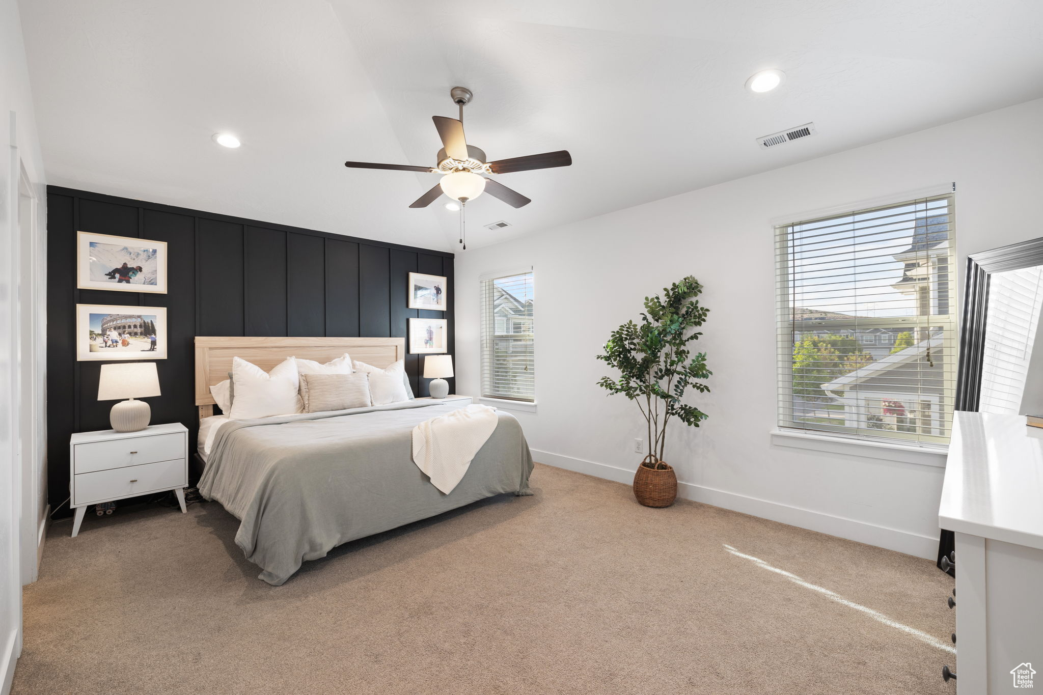 Bedroom featuring ceiling fan and carpet floors