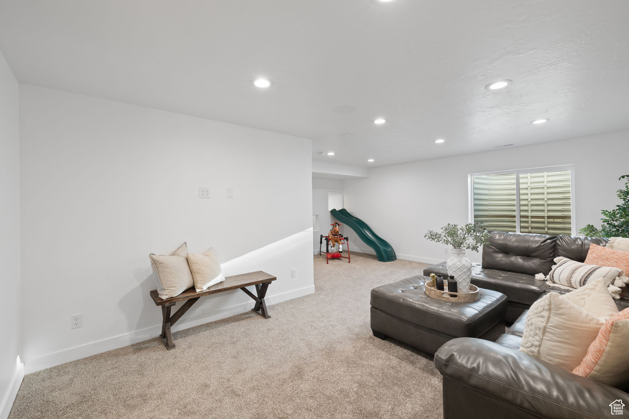 Living room featuring light carpet