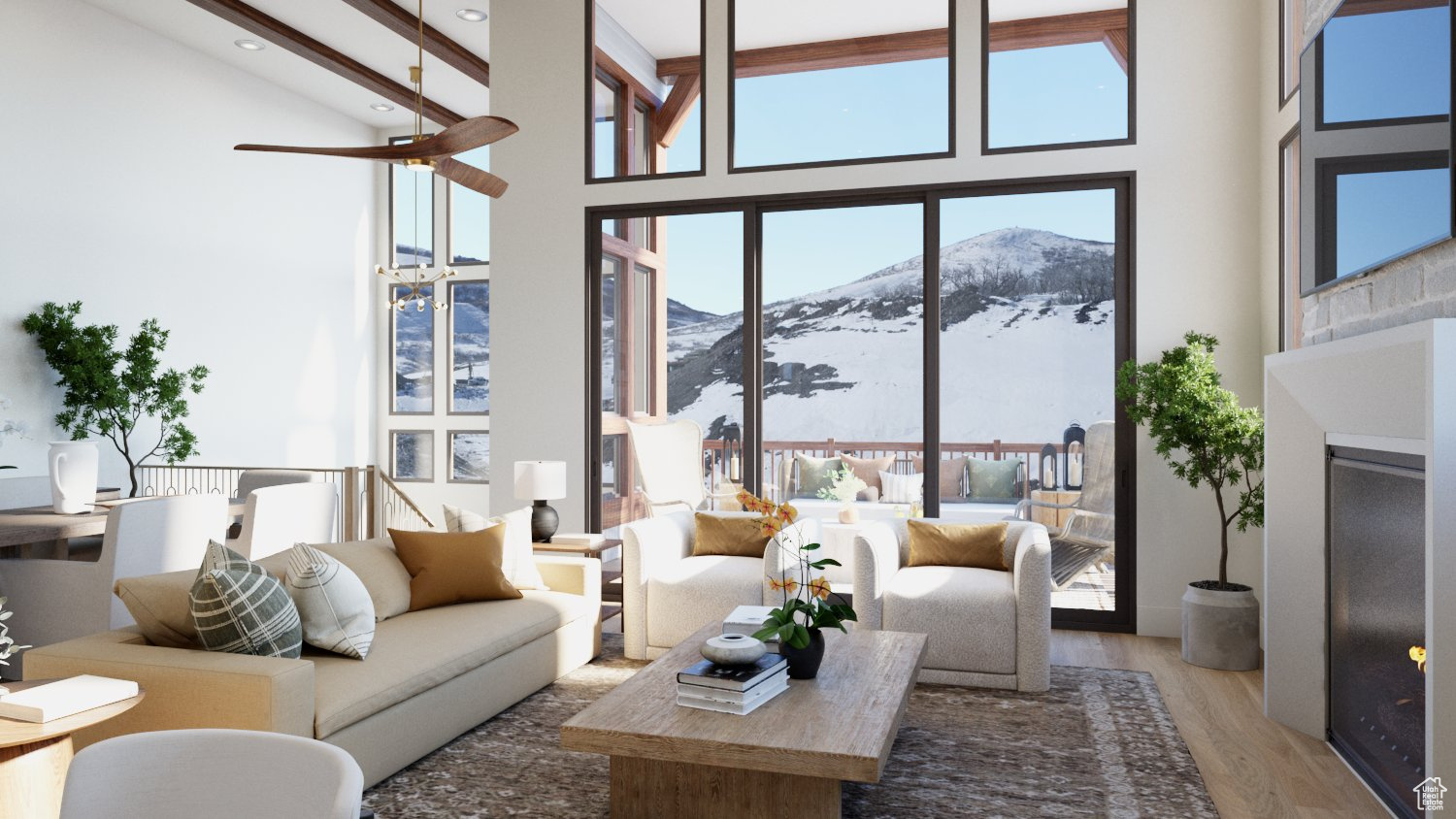 Living room with ceiling fan, hardwood / wood-style floors, beam ceiling, high vaulted ceiling, and a mountain view