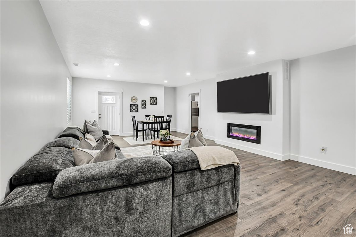 Living room with hardwood / wood-style flooring