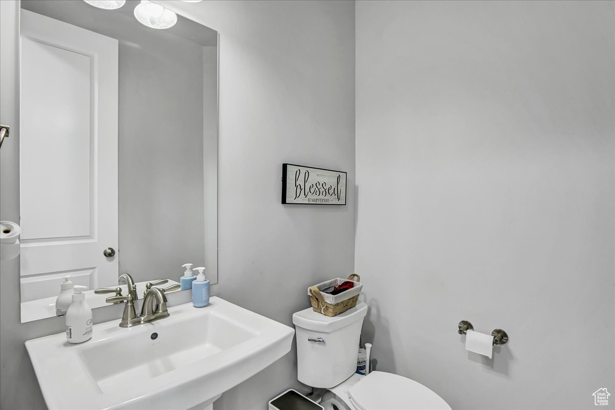 Bathroom featuring sink and toilet