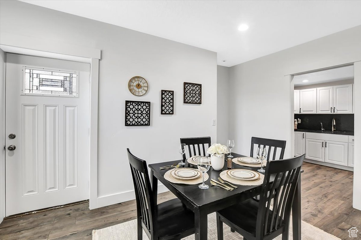 Dining area featuring sink and hardwood / wood-style floors