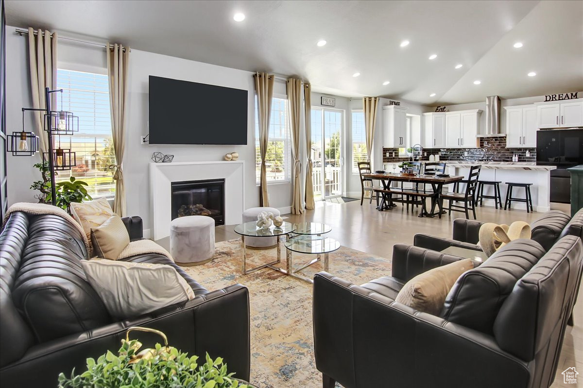 Living room featuring vaulted ceiling