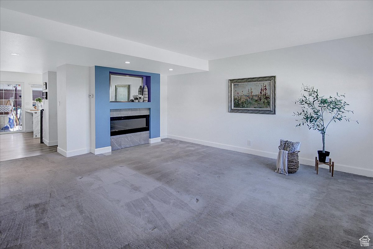 Unfurnished living room with carpet