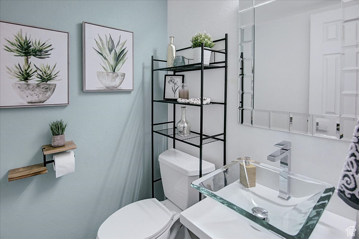 Bathroom with sink and toilet