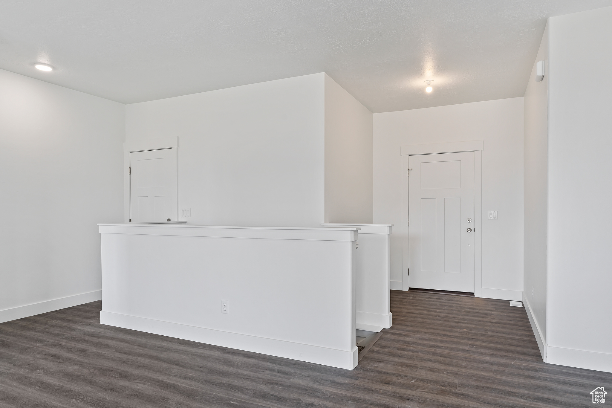 Spare room featuring dark hardwood / wood-style flooring