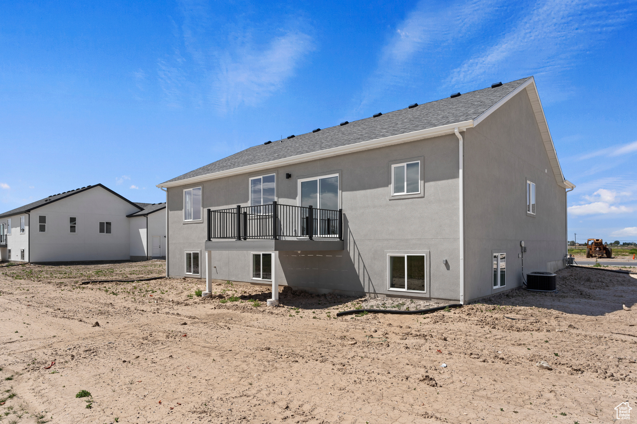 Back of property with central air condition unit