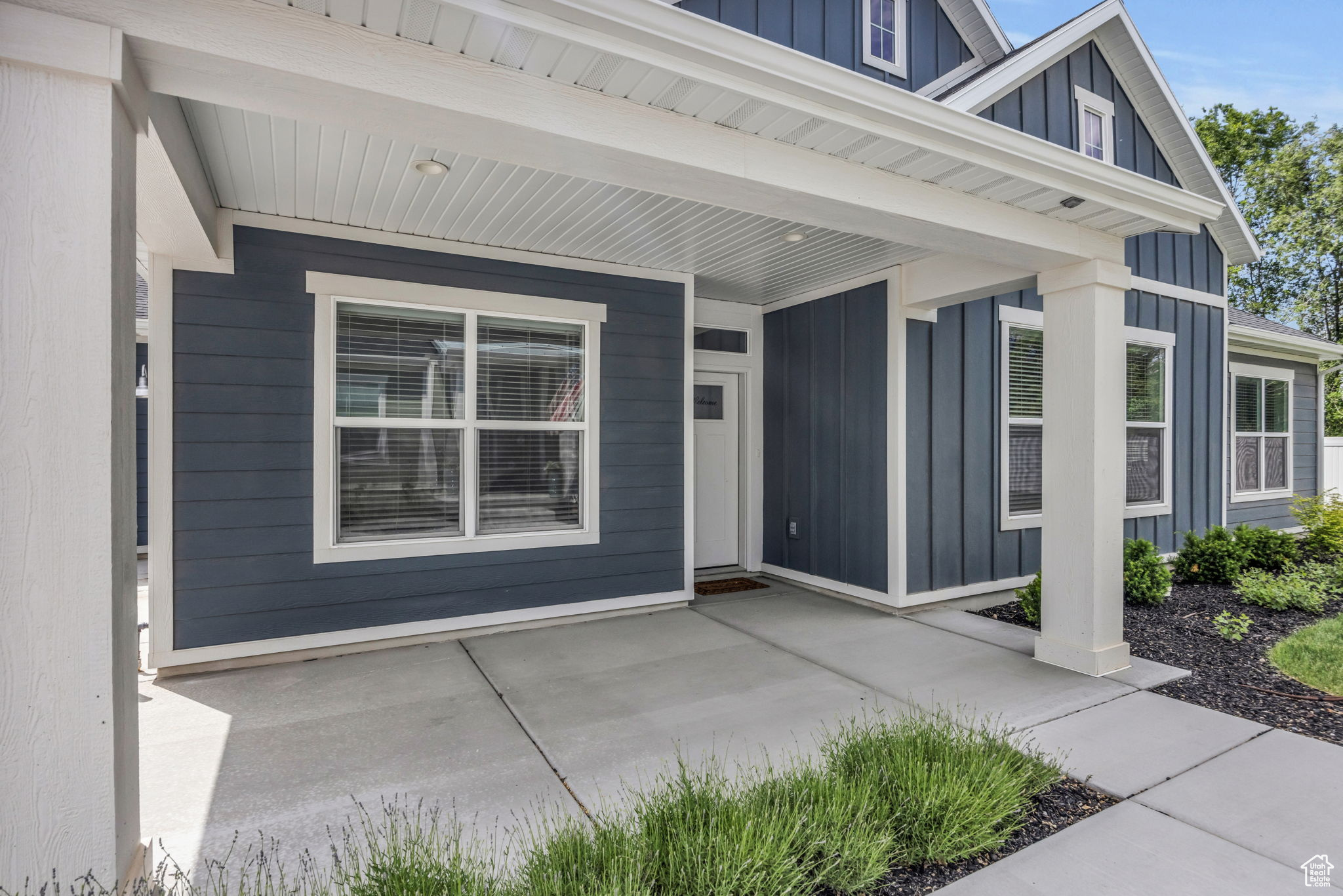 Doorway to property with covered porch