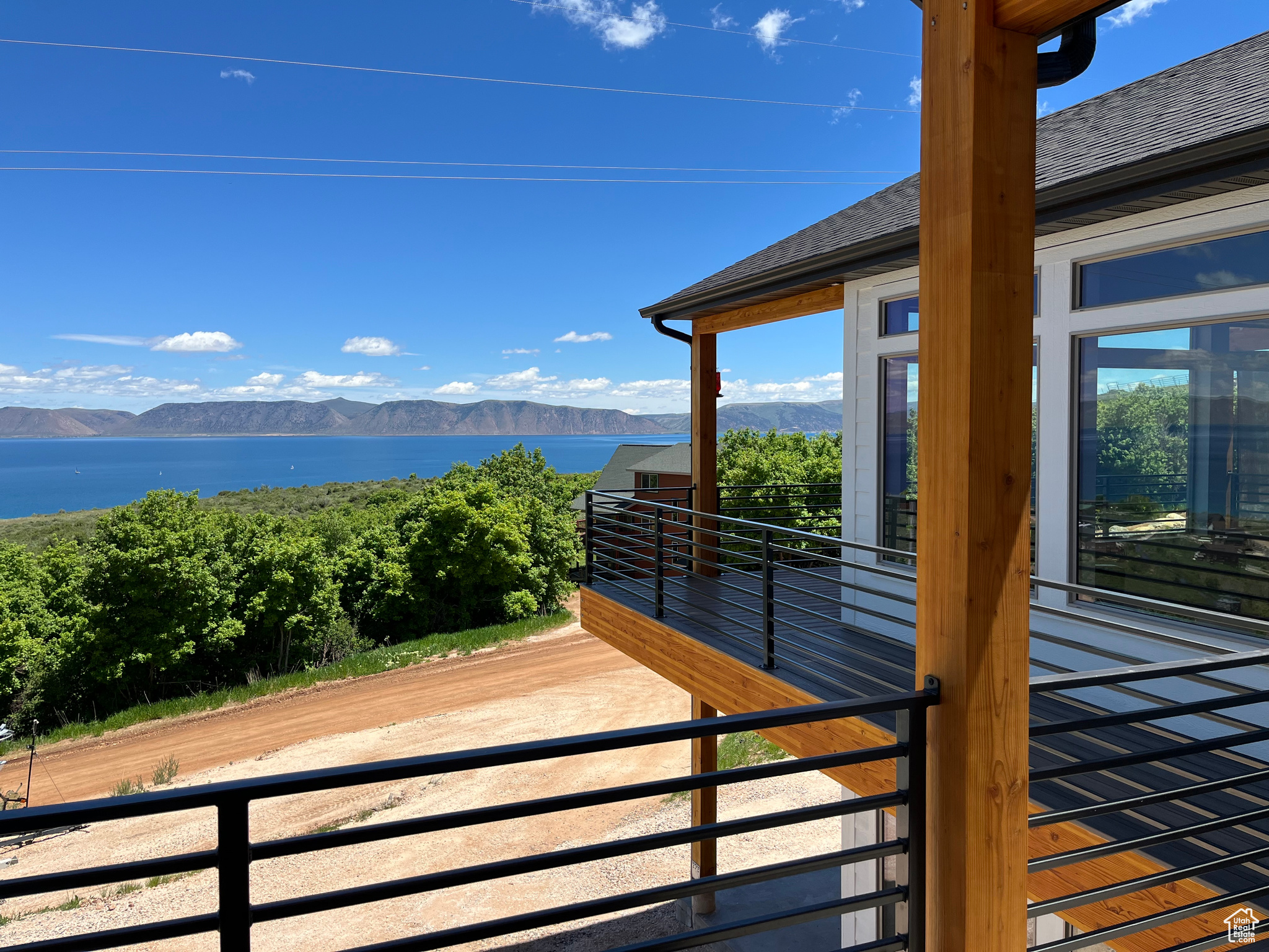 Exterior space with a water and mountain view just outside Master Suite