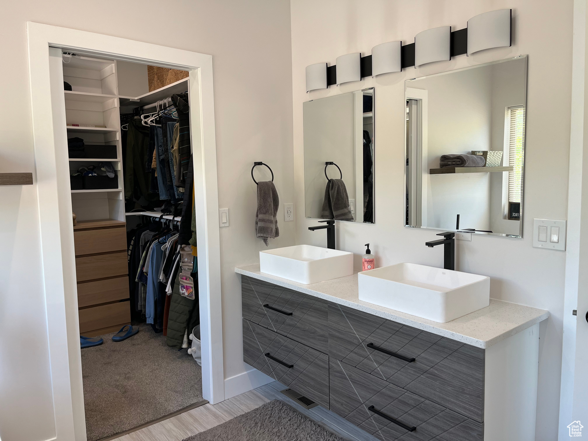 Master Bathroom featuring vanity with extensive cabinet space and double sink