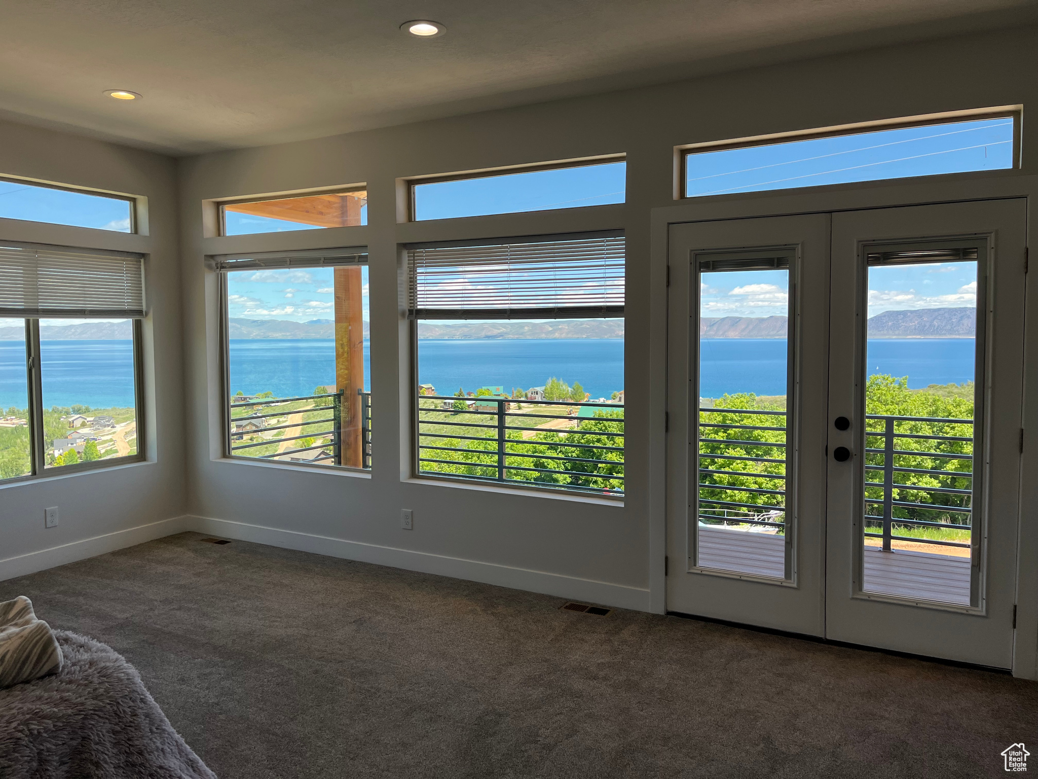 Master Suite featuring french doors and a water view