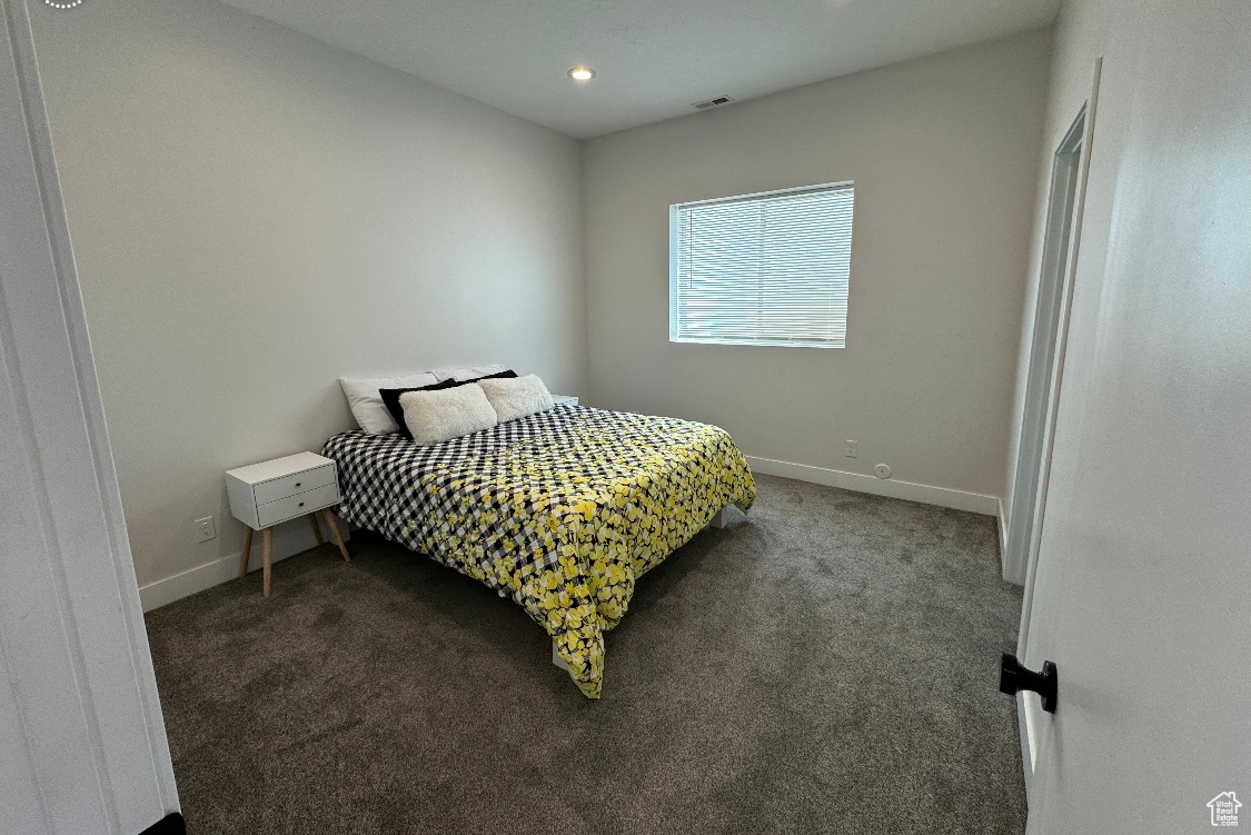 Bedroom with carpet flooring