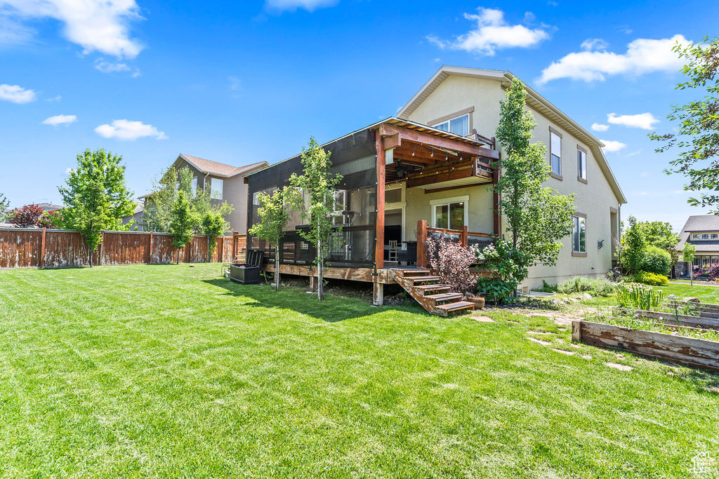 Back of house with a 16x24 Covered Deck, Outdoor Living off the Great Room. Very Private backyard