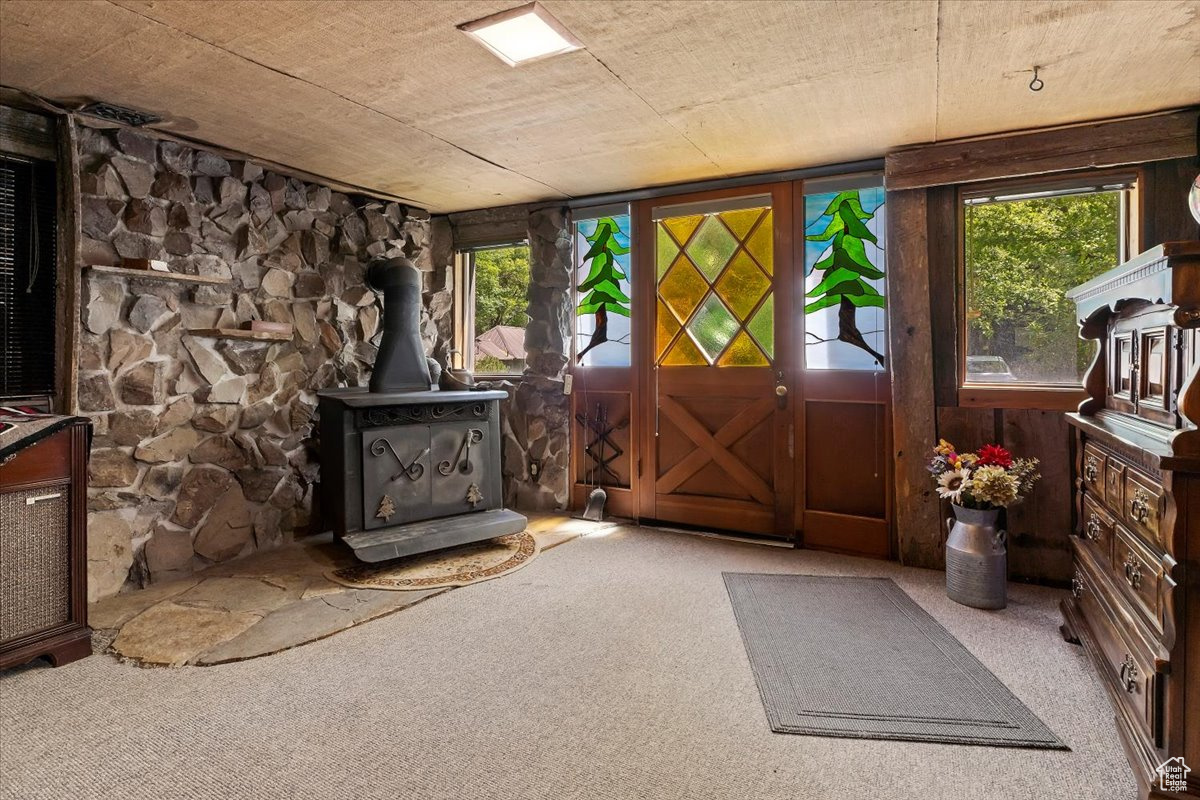 Basement family room with outside entrance and wood burning stove.