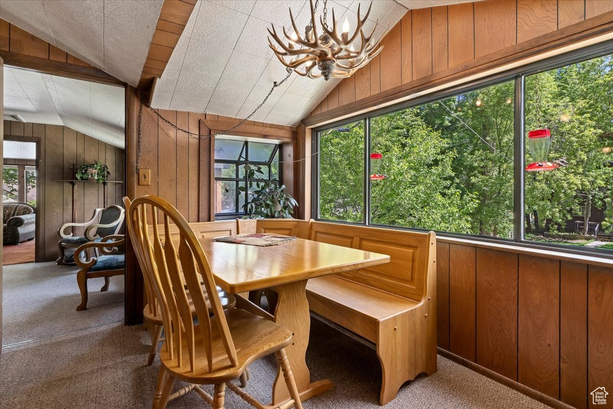 Dining space featuring an inviting chandelier.