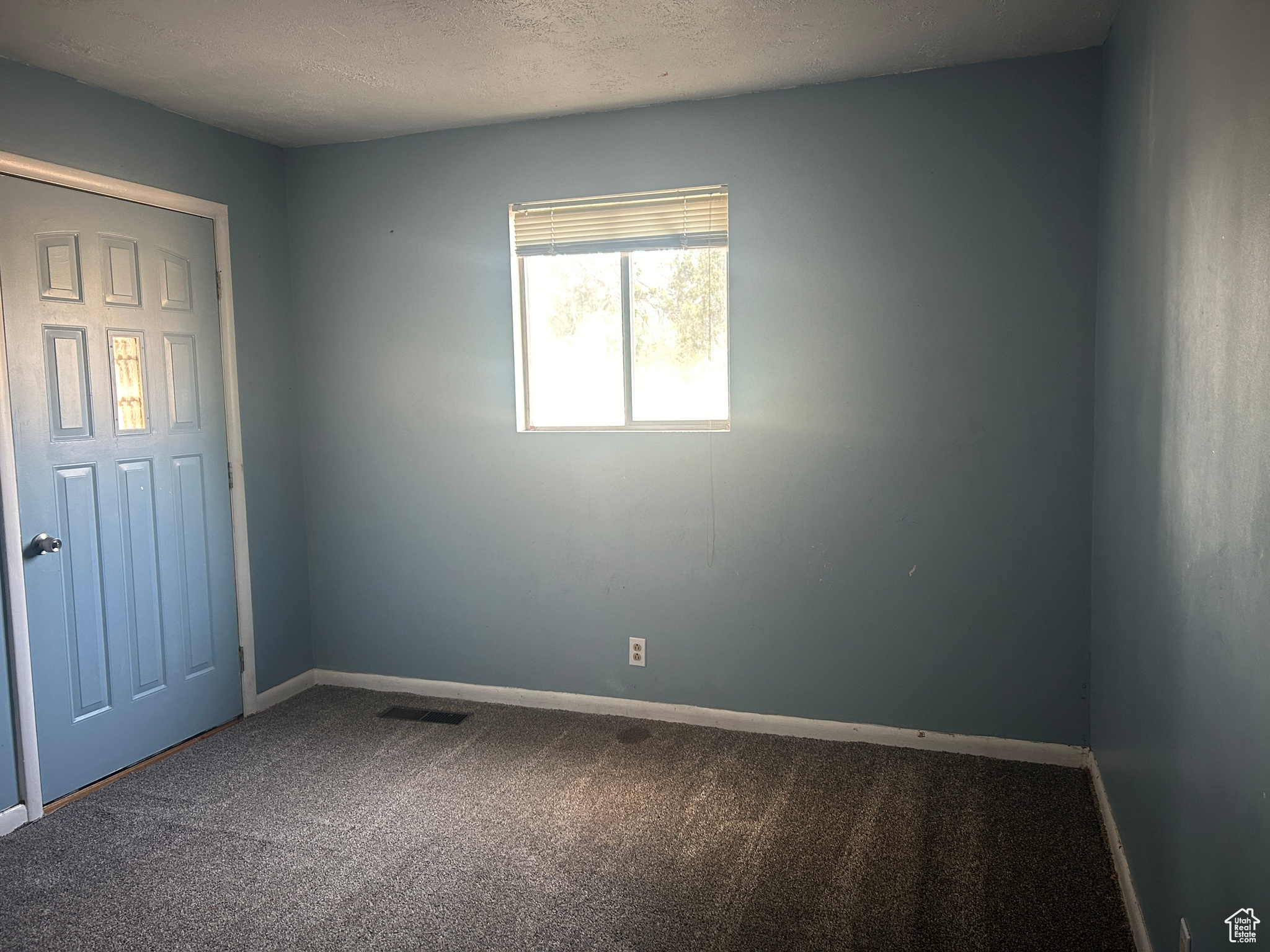 Spare room featuring carpet floors